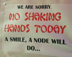 Sign in Africa Telling You Handshakes Are Out But 'A Node' Is OK!