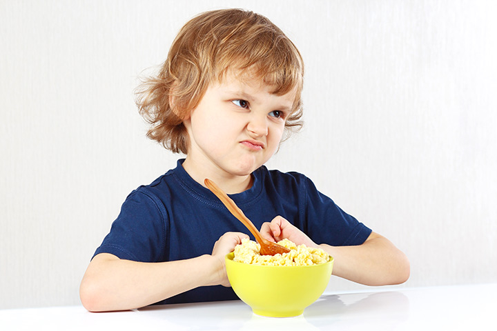 Child making sour face at food