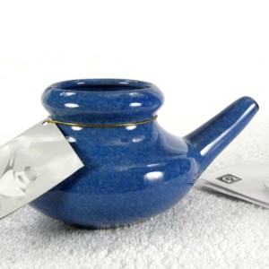 Blue Teapot Sitting on Floor