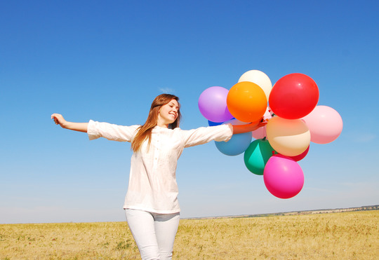 young happy woman with balloons