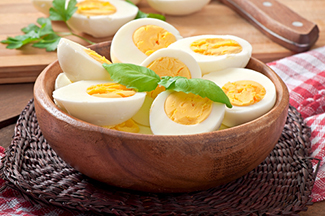Hard boiled eggs wooden bowl